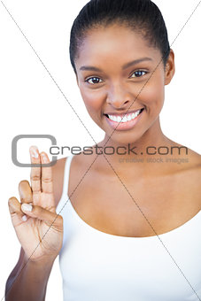 Woman showing moisturiser on her fingers