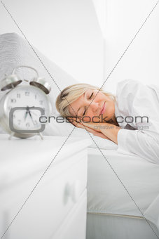 Blonde woman in bed asleep