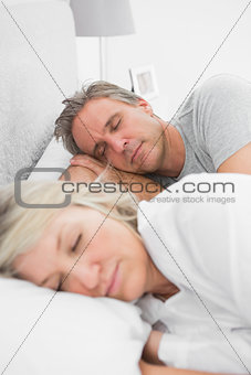 Happy couple sleeping peacefully