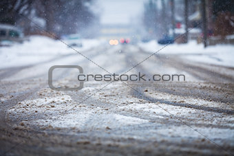 Snow-covered road, the marks of wheels 