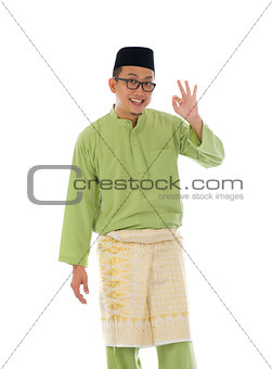 Malay indonesia male with ok sign during ramadan isolated white 