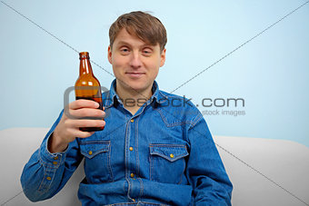 Man relaxing with a bottle of beer