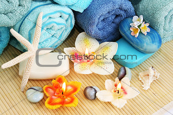 Towels, soaps, flowers, candles