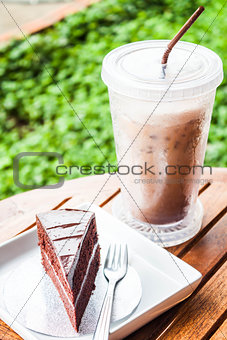 Refreshing break with cold coffee and chocolate cake 