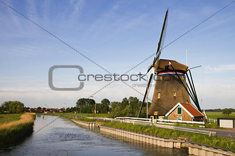 Dutch windmill and country road