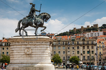 Statue of King Joao I at Figueiroa Square and St. Jorge Castle i