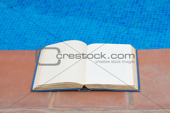 summer reading near pool