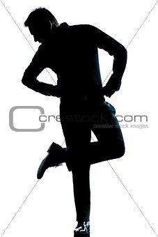 silhouette man full length looking at his shoes