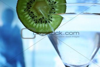 Glass with a plate kiwi
