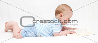 Baby boy reading a book