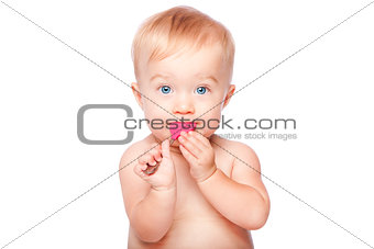 Cute baby with food spon in mouth