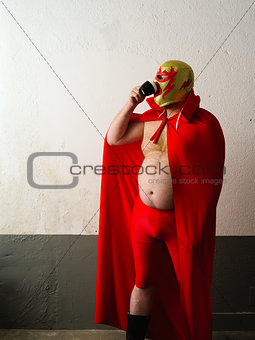 Mexican wrestler drinking coffee