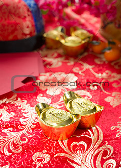 Chinese gold ingot with setups on background