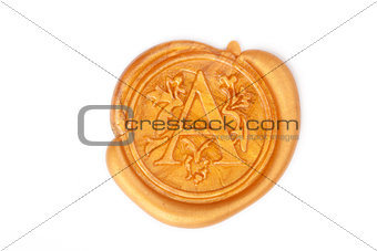 Gold wax seal isolated on white 