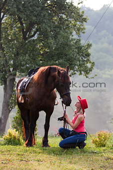 Woman in red hat riding