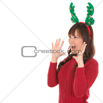 Happy Asian Santa woman shouting