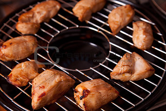Grilled chicken meat on gas grill 