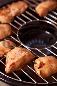 Chicken meat on gas grill 