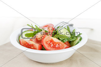 served plate with mix salad from tomatoes and cucumbers