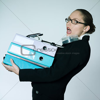 business woman carrying files and folders