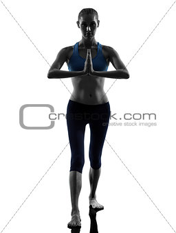 woman exercising yoga warrior position