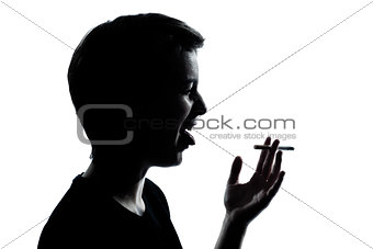one young teenager boy or girl smoking cigarette disgust silhoue