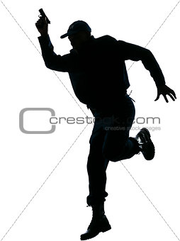 Policeman running with a handgun