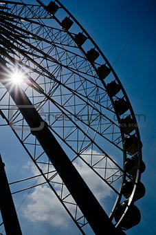 Silhouette Ferris wheel under Sun Light