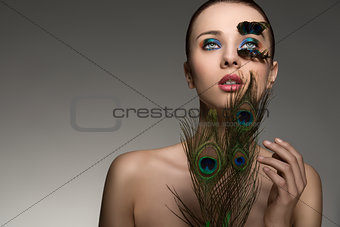 beauty portrait with colored feathers 