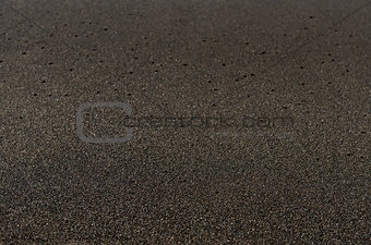 Black sand volcanic beach background