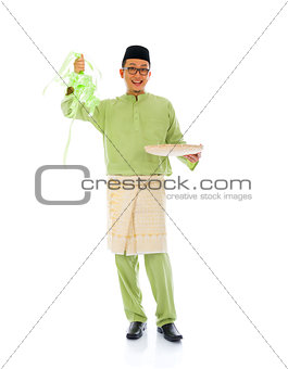 indonesian male with ketupat during ramadan festival with isolat