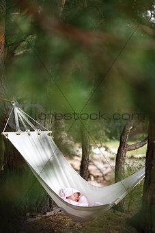 baby sleeping in hammock