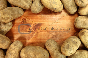 Russet Potatoes on a Wooden Background