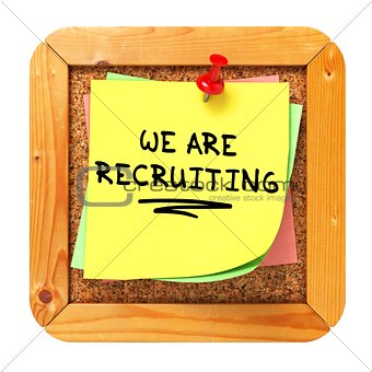 We are Recruiting. Yellow Sticker on Bulletin.