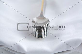 Dessert spoons over a white napkin