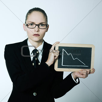 serious business woman holding graphic board with deacreasing cu