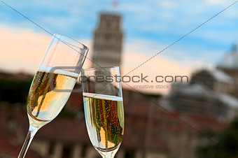 Two glasses of champagne with the Tower of Pisa in the backgroun