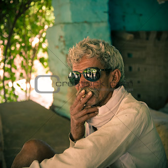 Smoking by old indian villager