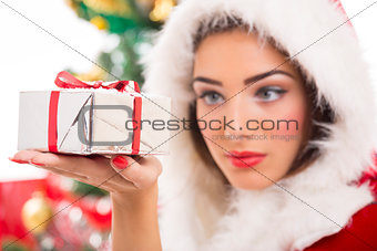 Beautiful Santa girl holding gift box