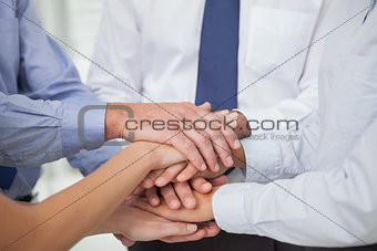Close up on colleagues hands all together