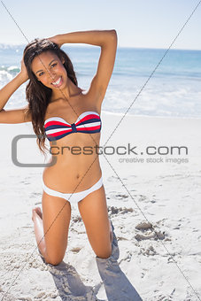 Happy young sexy woman taking sun