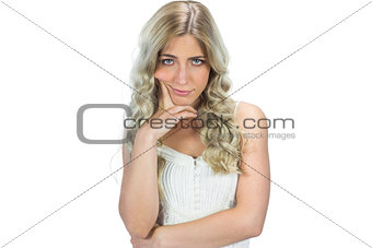 Unhappy seductive model in white dress