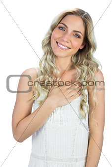 Smiling curly haired blonde being congratulating