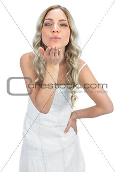 Cheerful  blonde sending a kiss to camera