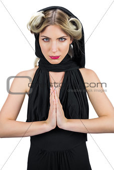 Relaxed mysterious blonde wearing black clothes posing