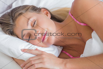 Beautiful blonde sleeping peacefully in bed