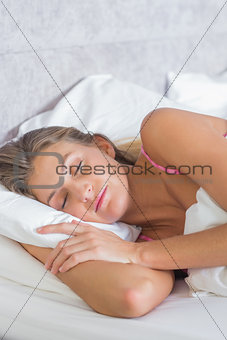Pretty blonde sleeping peacefully in bed