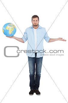 Charming model holding a globe and making faces