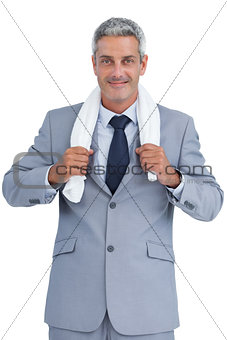 Self assured businessman with white towel on shoulders