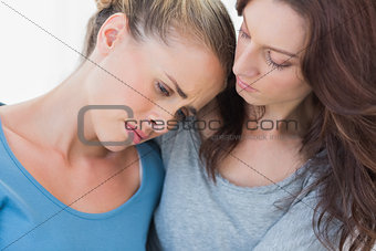 Woman consoling her friend